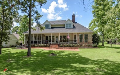 Rear view of home and welcoming outdoor living spa