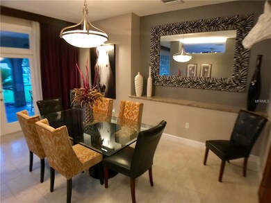 Dining room gives entry to screened porch