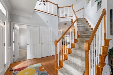 Bright and inviting entrance with a curved stairwe