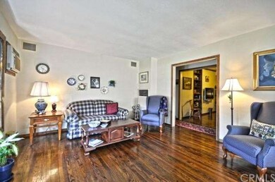 From the living room, enter the hall and den.  