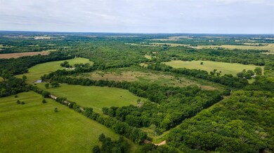 Overview of rural landscape with a heavily wooded area