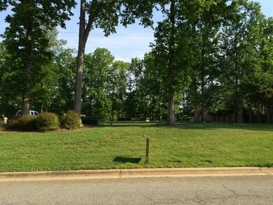 Front view of lot. Established hardwoods and landscaping. Covered shelter at back of lot.