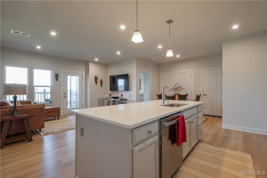 Kitchen featuring sink, decorative light fixtures,