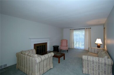 Large windows at both ends of the living room allo
