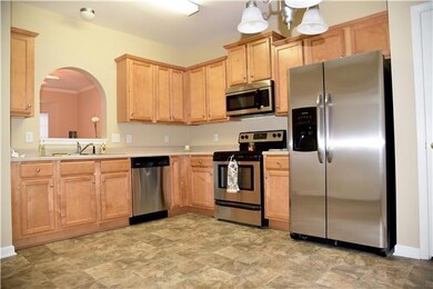 Smooth-top stove, built-in microwave, dishwasher and 26 cu. ft. side by side refrigerator.  New vinyl flooring.  