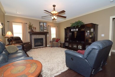 Open concept family room with fireplace.