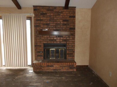 Living Room. Nice brick fireplace with insert.  Bu
