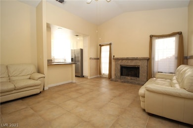 Breakfast bar joins the kitchen and family room to
