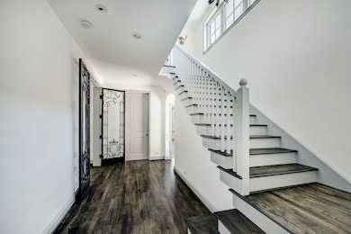 Upon entry, notice the light & bright tone found within this home as gleaming hardwoods lead one inside.