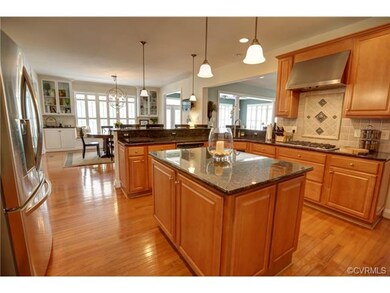 Large kitchen with breakfast bar and eat-in area.