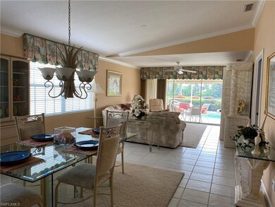Dining area and family room overlooking pool