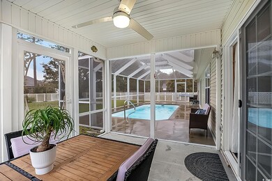 Sunroom / solarium featuring a hot tub, lofted cei