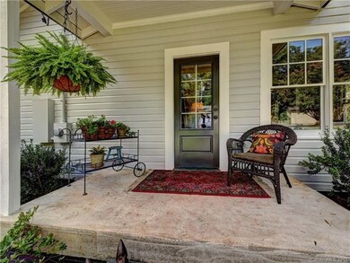 Charming covered entrance to rear of house