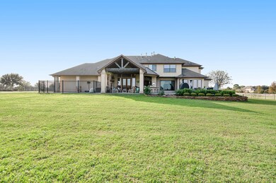 Back of home with a covered patio, extended uncove