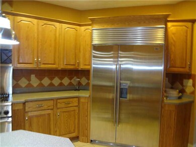 Kitchen. Oversized Subzero refrigerator is an adde