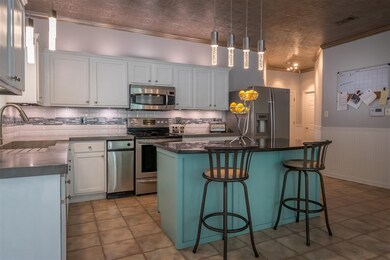 Remodeled kitchen with decorative concrete counter