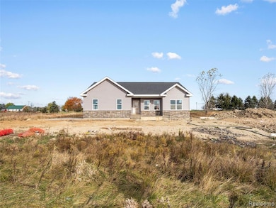 Ranch-style home with a porch and stone siding