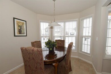 Beautiful dining setting with bay windows.