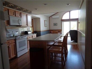 View from kitchen to dining area. ...
