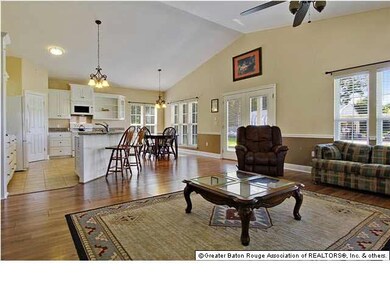 View of living, dining and kitchen