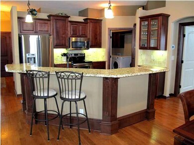 Granite Kitchen with eating bar, walk-in pantry an