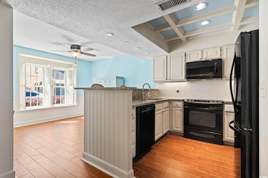 Kitchen with visible vents, light wood finished fl