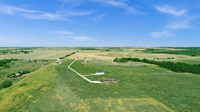 Birds eye view of property with a rural view