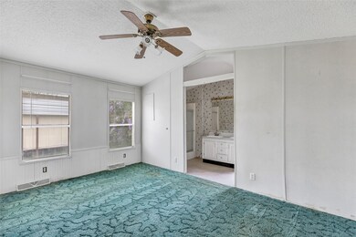 This room features a vaulted ceiling with a ceilin