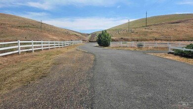 View of street with a mountain view and a view of rural / pastoral area