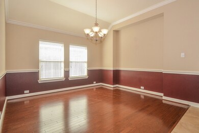 Imagine your family gathered around the formal dining room table in this charmingly detailed room. Lovely wood trim work, vaulted ceiling, and a gorgeous chandelier make this room truly exceptional.

