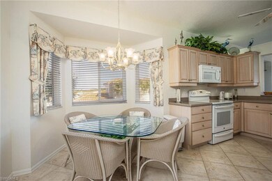 Kitchen featuring light brown cabinetry, light til