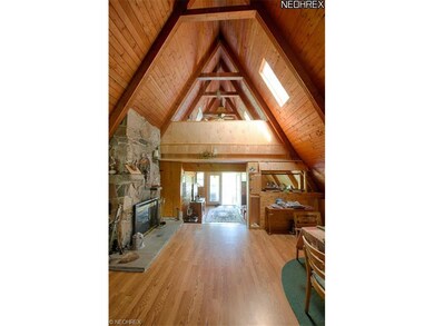 Living room with fireplace and pergo flooring