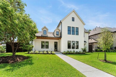This is a modern two-story home with a crisp white