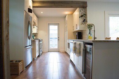 Kitchen looking to back yard/garage