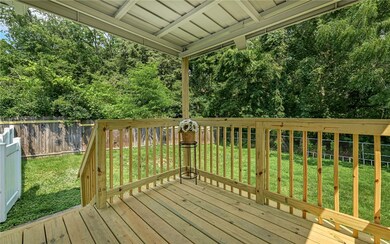 New Back Porch overlooks the Large fenced in backyard