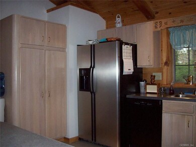 Refridgerator area with pantry.