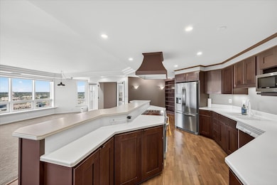 The beautiful kitchen is fully open for entertaining but the higher countertop adds great privacy to your cooking and clean up.
