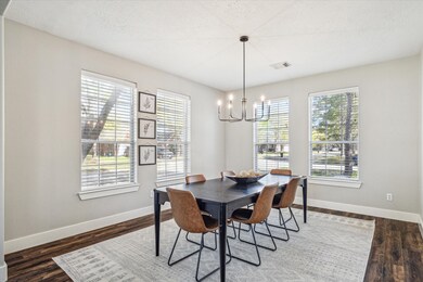 Spacious Formal Dining with updated lighting featu