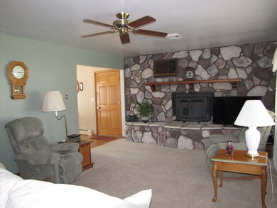 Main level living room with fireplace