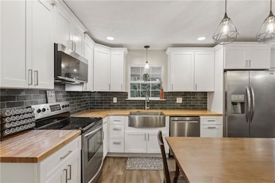 Newly remodeled kitchen with Frigidaire & KitchenAid appliances.