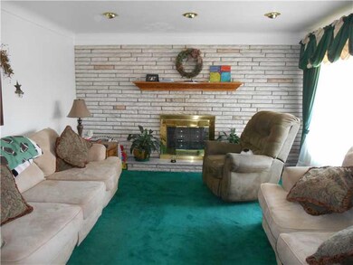 Living Room. The gas fireplace has a marble sill a