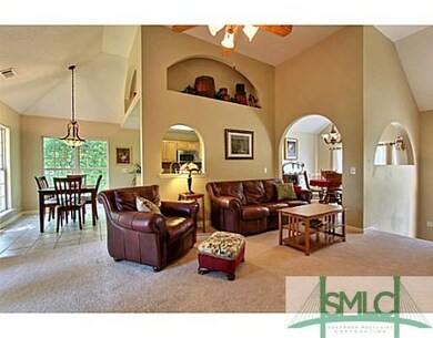 Living Room. Notice the new carpet and high ceilin