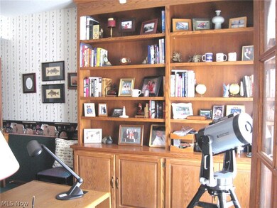 The first floor office features built-in bookshelves.