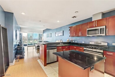 Kitchen featuring visible vents, a kitchen island,