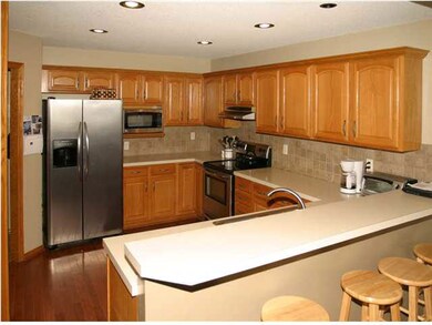View of kitchen eating bar and lots of counter spa
