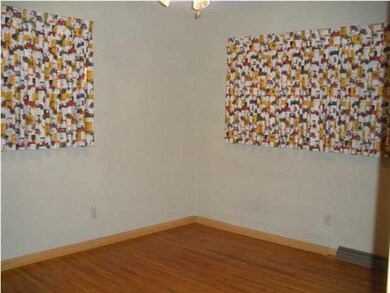 Bedroom #3 10x12 with original hardwood floors