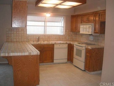 Fully appliance kitchen.  Garden window.