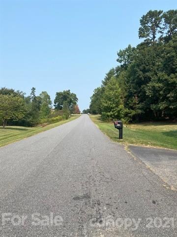 Wider view of Cordia Circle, approaching wooded Lo