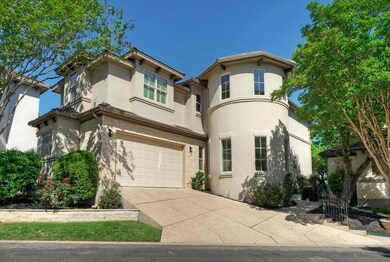 View of front facade featuring driveway, stucco s