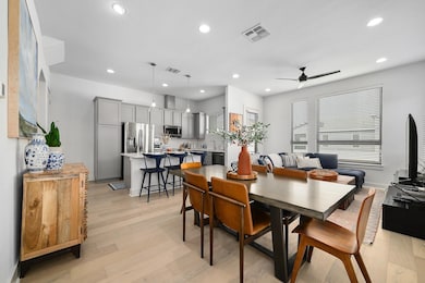 Dining room with light wood-style floors, recessed lighting, and ceiling fan